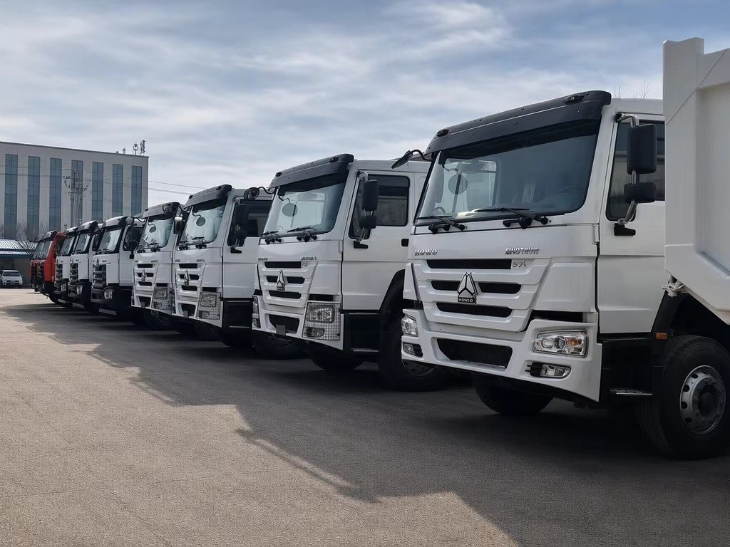 Line-up of HOWO heavy duty dump trucks at our yard