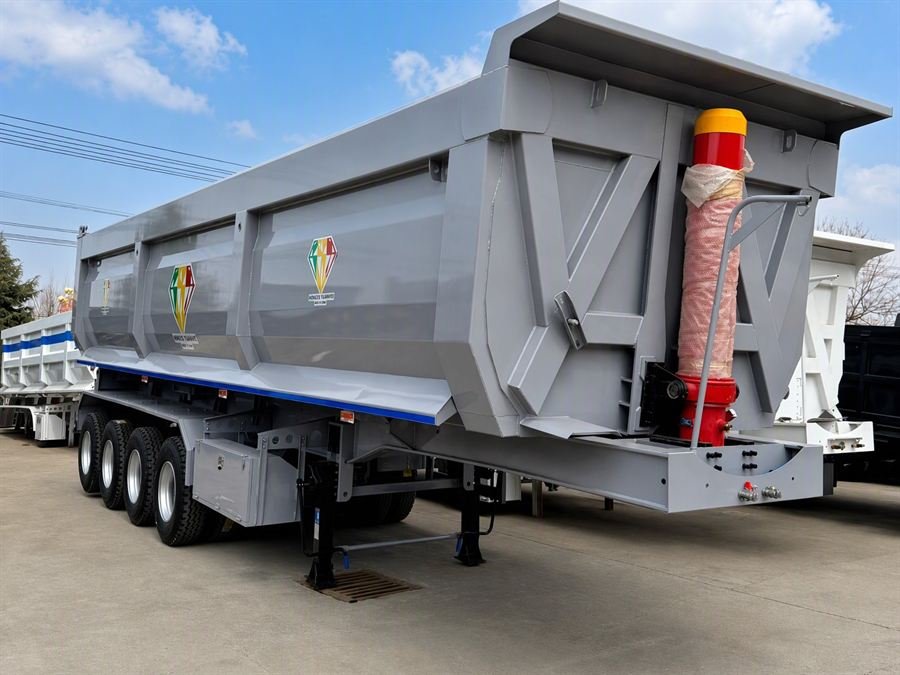 Trucks and semi-trailers prepared for export at the Tengma International yard